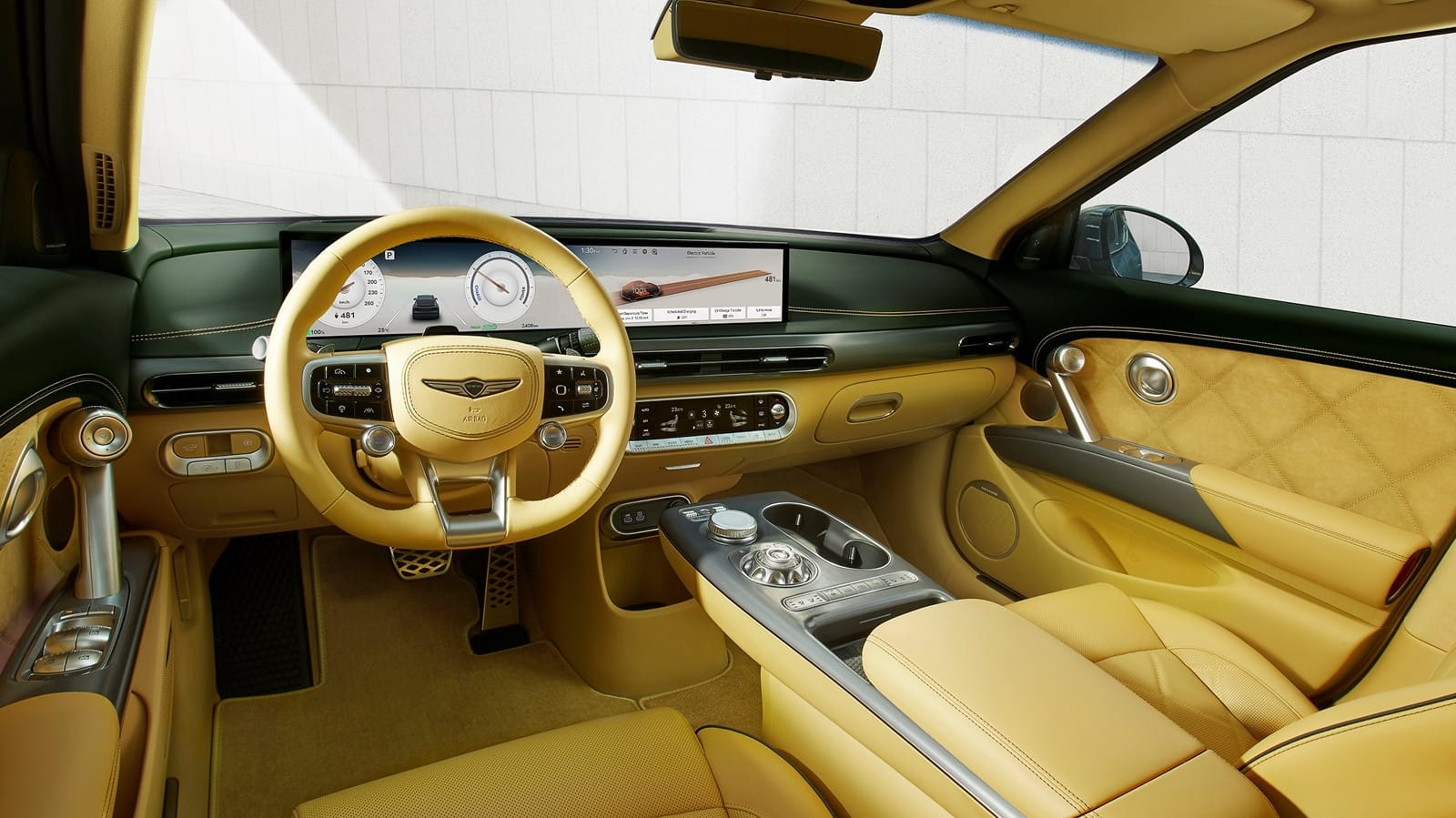 Interior of the Genesis GV60 Performance AWD featuring a luxury dashboard, digital displays, and premium leather seating.