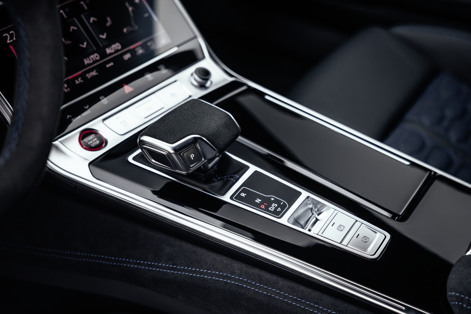 Close-up of Audi RS e-tron center console with gear selector and digital controls