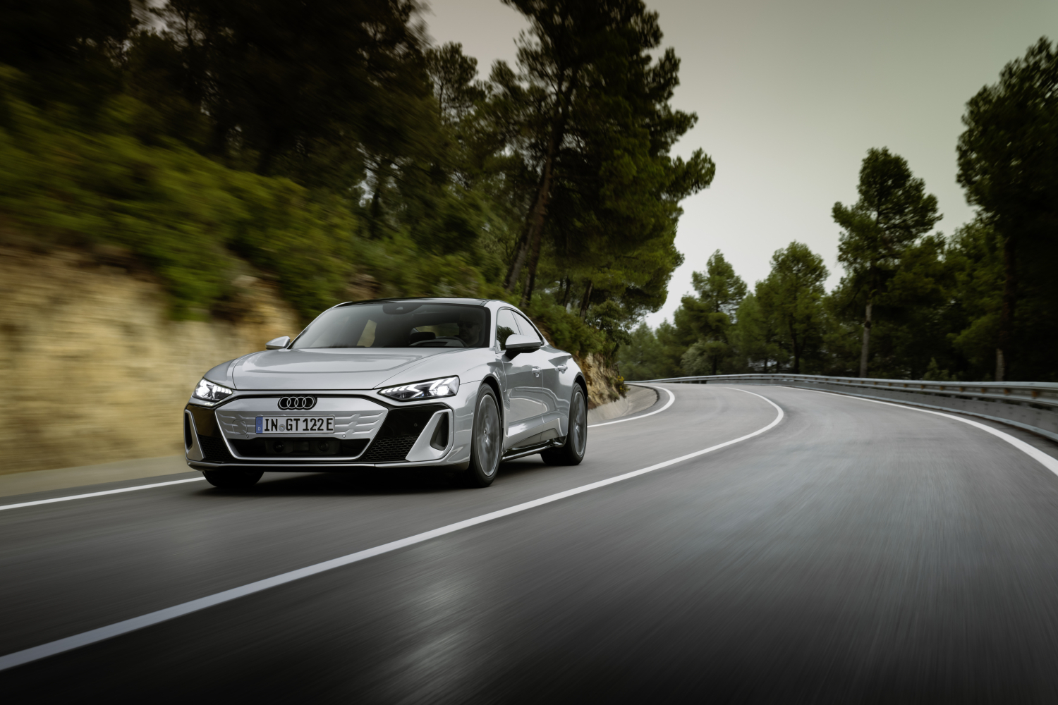 Audi RS e-tron GT front view driving on a mountain road curve