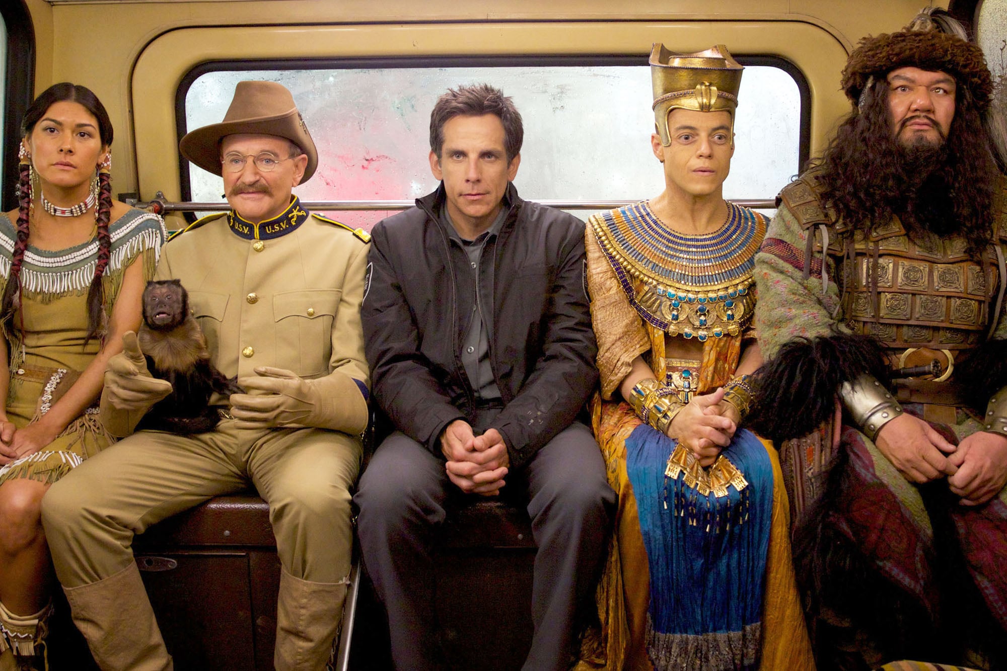 Main cast of Night at the Museum posing in the museum hall