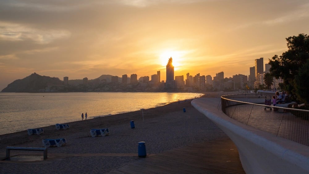 Golden sunset on the poniente beach in benidorm spain
