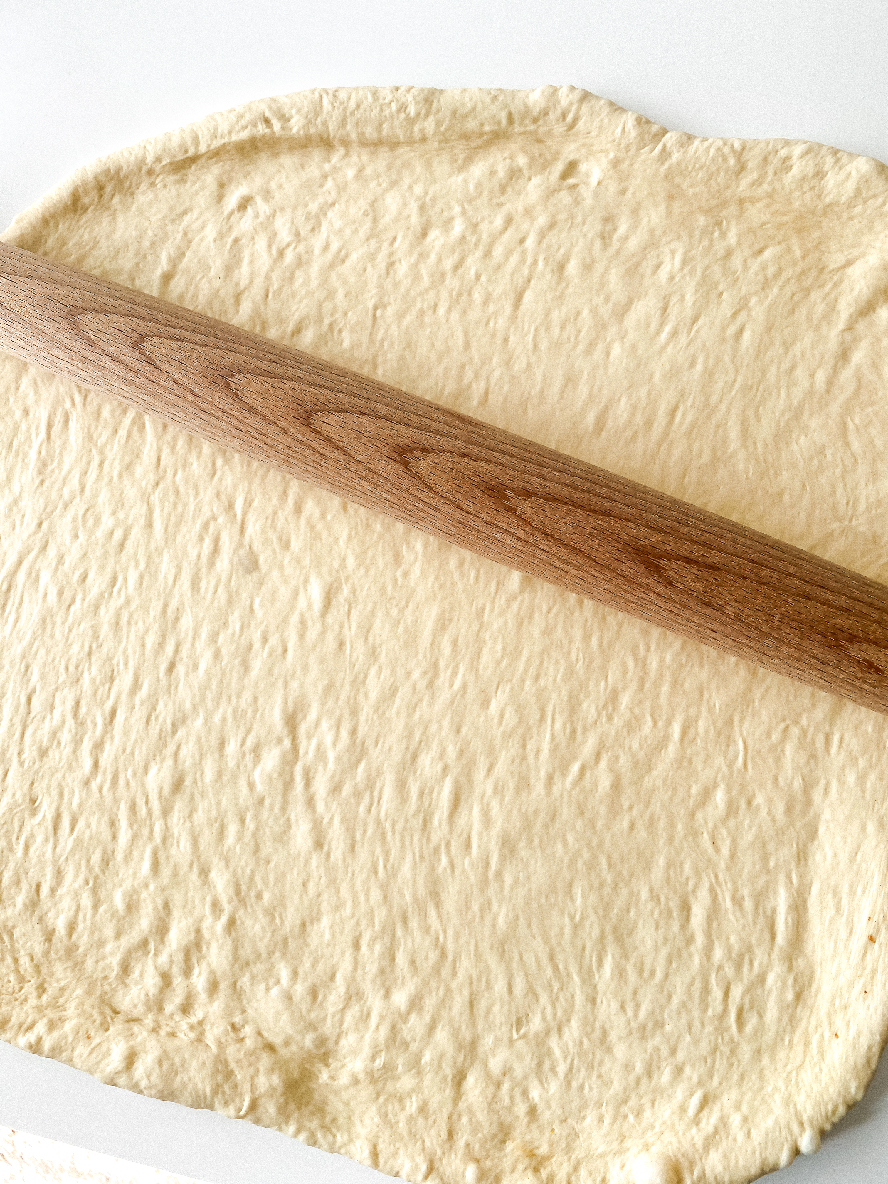 Wooden rolling pin, rolling out pizza dough