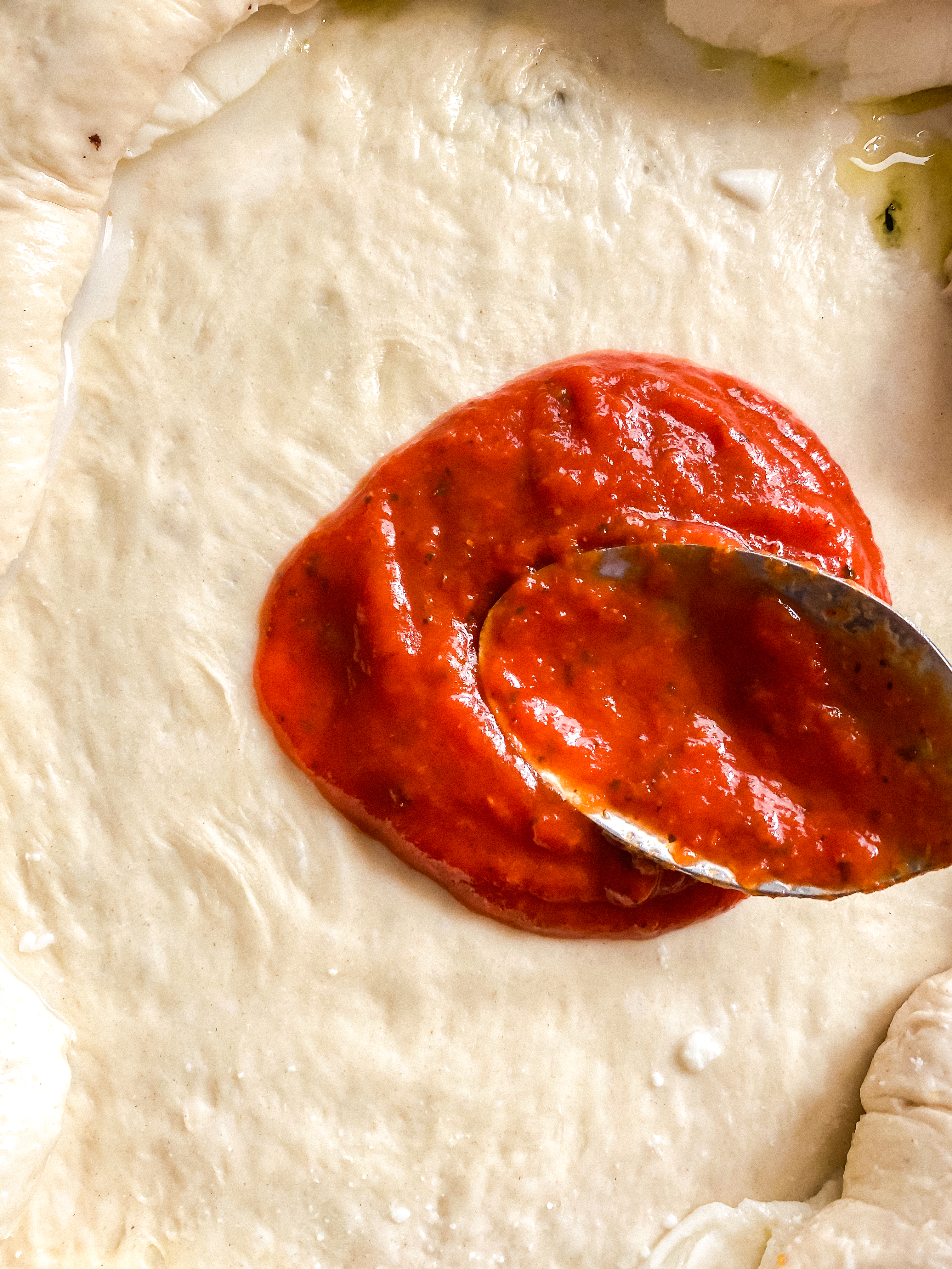 Pizza sauce on Stuffed Crust Cast Iron Pizza