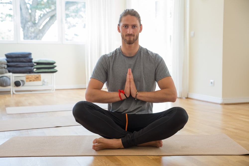 Young male doing yoga