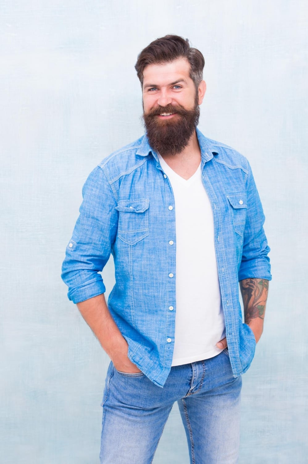 Statement denim jacket male casual style denim look brutal hipster with mustache barbershop client mature hipster with beard denim shirt essential garment modern wardrobe clothes shop model