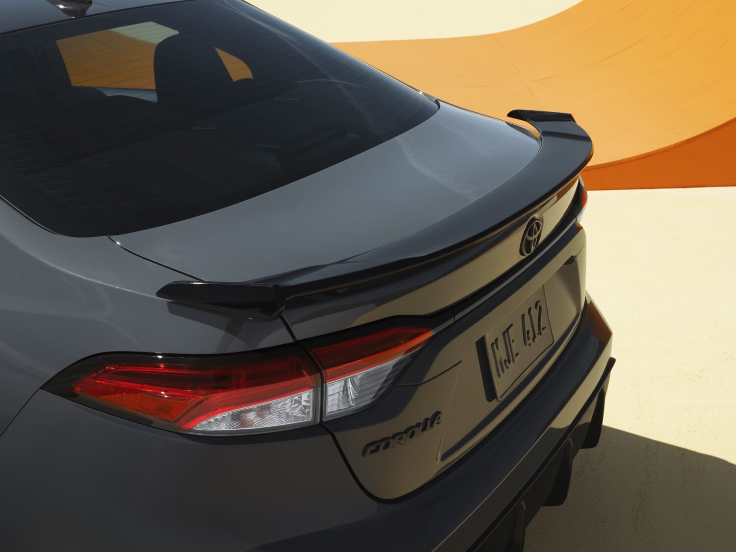 Close-up of the 2025 Toyota Corolla FX rear spoiler and taillights
