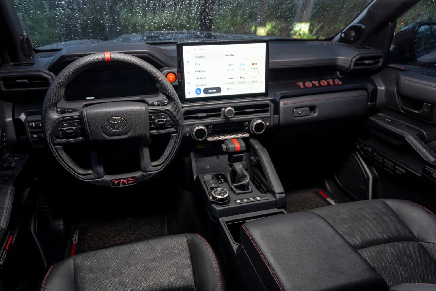 Interior dashboard view of the 2026 Toyota 4Runner TRD Pro showing steering wheel, center console, and large touchscreen infotainment system.