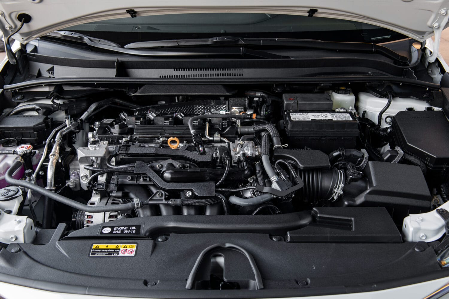 Engine bay of 2026 Toyota Corolla Cross XLE AWD showing 2.0-liter engine