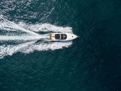 Photo aerial view of speed motor boat on open blue sea