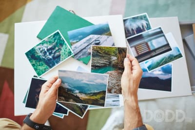 elderly woman looking at photos photo album