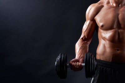 Young male workout lifting weights