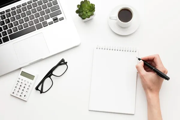 Close-up hand holding pen