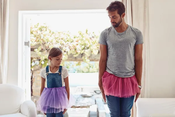 father dressing up with teen daughter