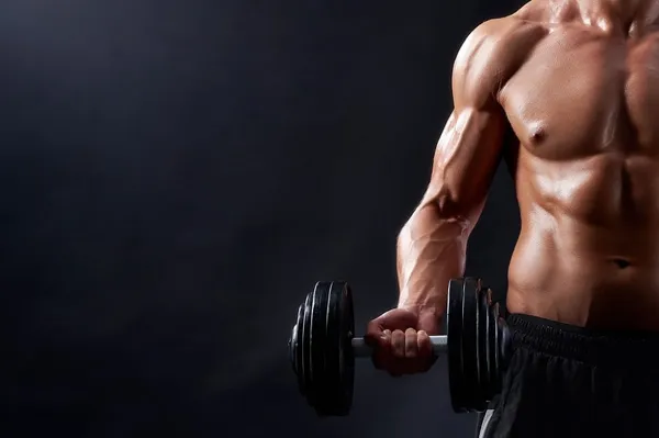Young male workout lifting weights