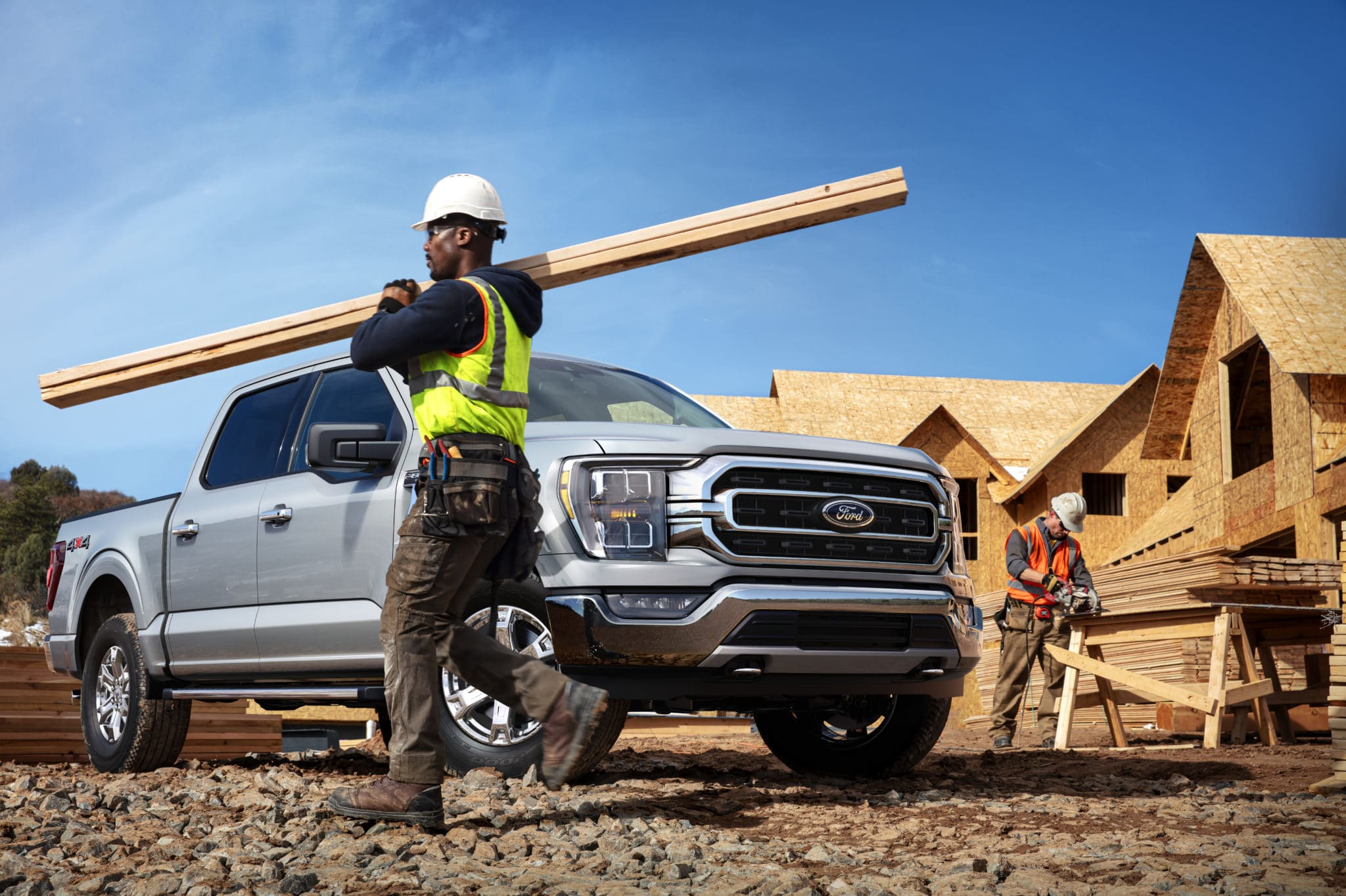 contractor hauling lumber at a construction site, using a F-150 - Built ford Tough