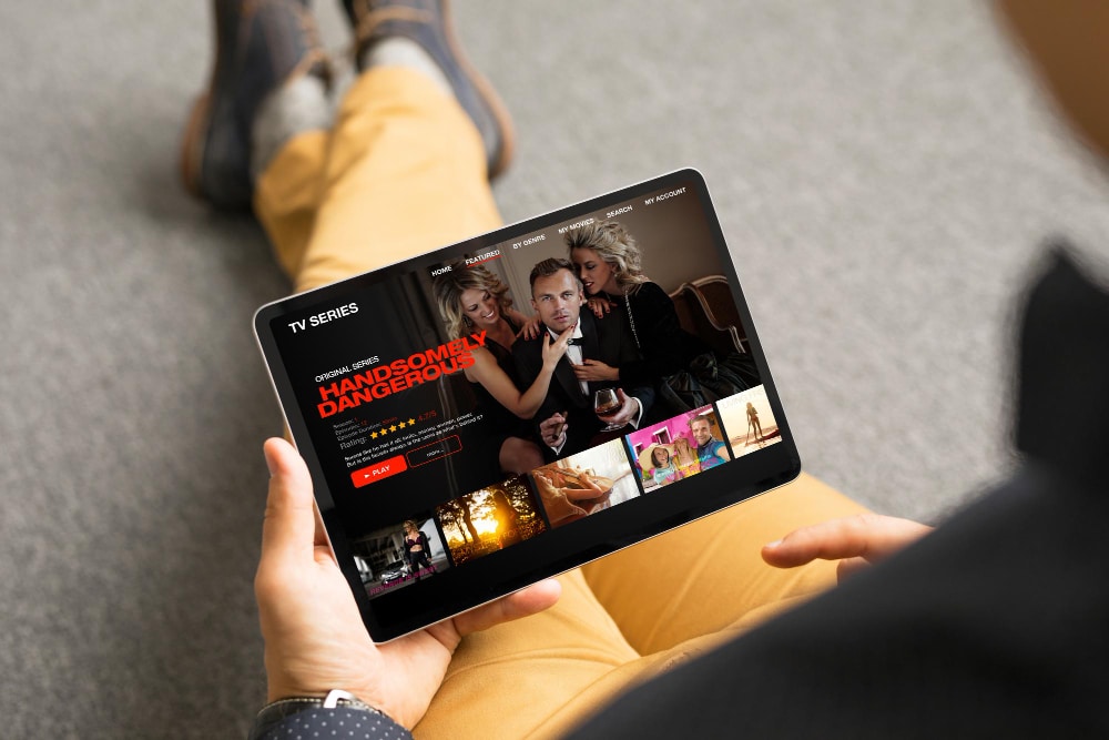 Photo man looking tv series and movies via streaming service on his digital tablet