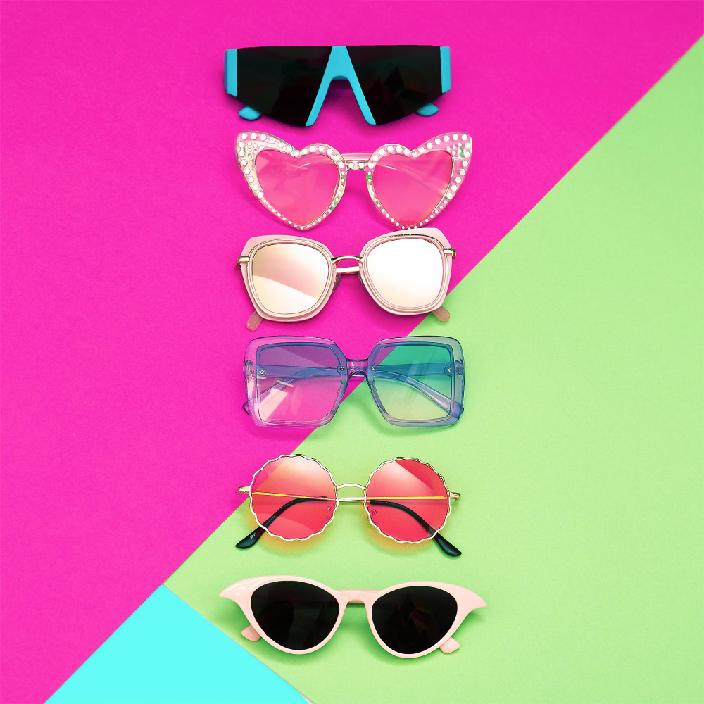 Set of stylish sunglasses summer sale trendy flat lay minimal scene