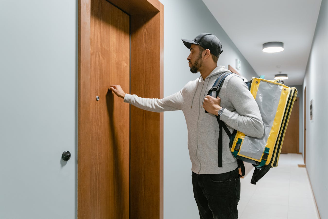 Deliveryman Knocking on a Door